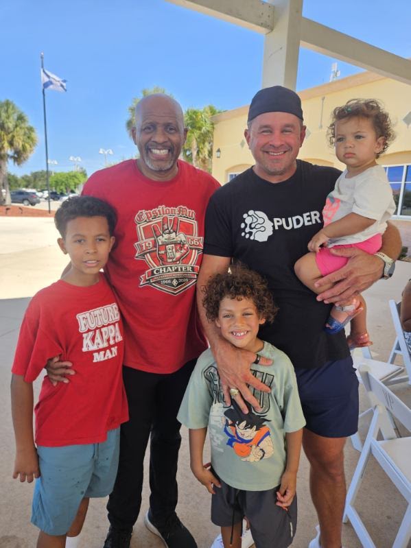 Dr. Jennings with families and children at a community event
